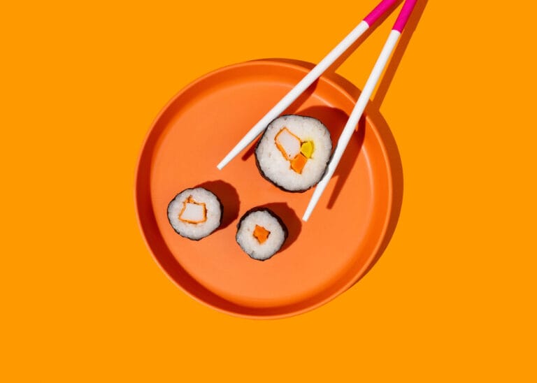 chopsticks with sushi
